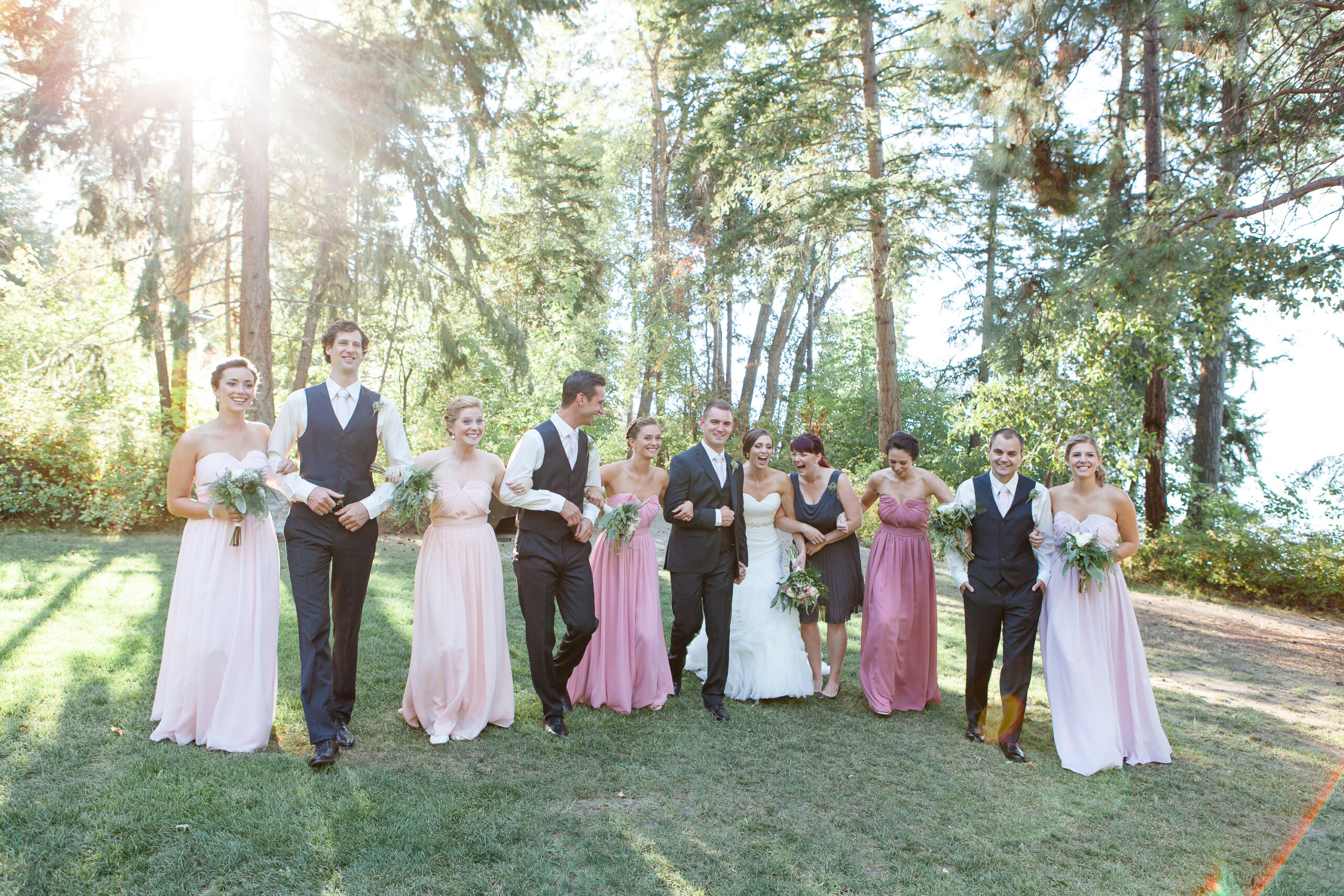 Wedding party walking with their arms linked at Okanagan Wedding Venues