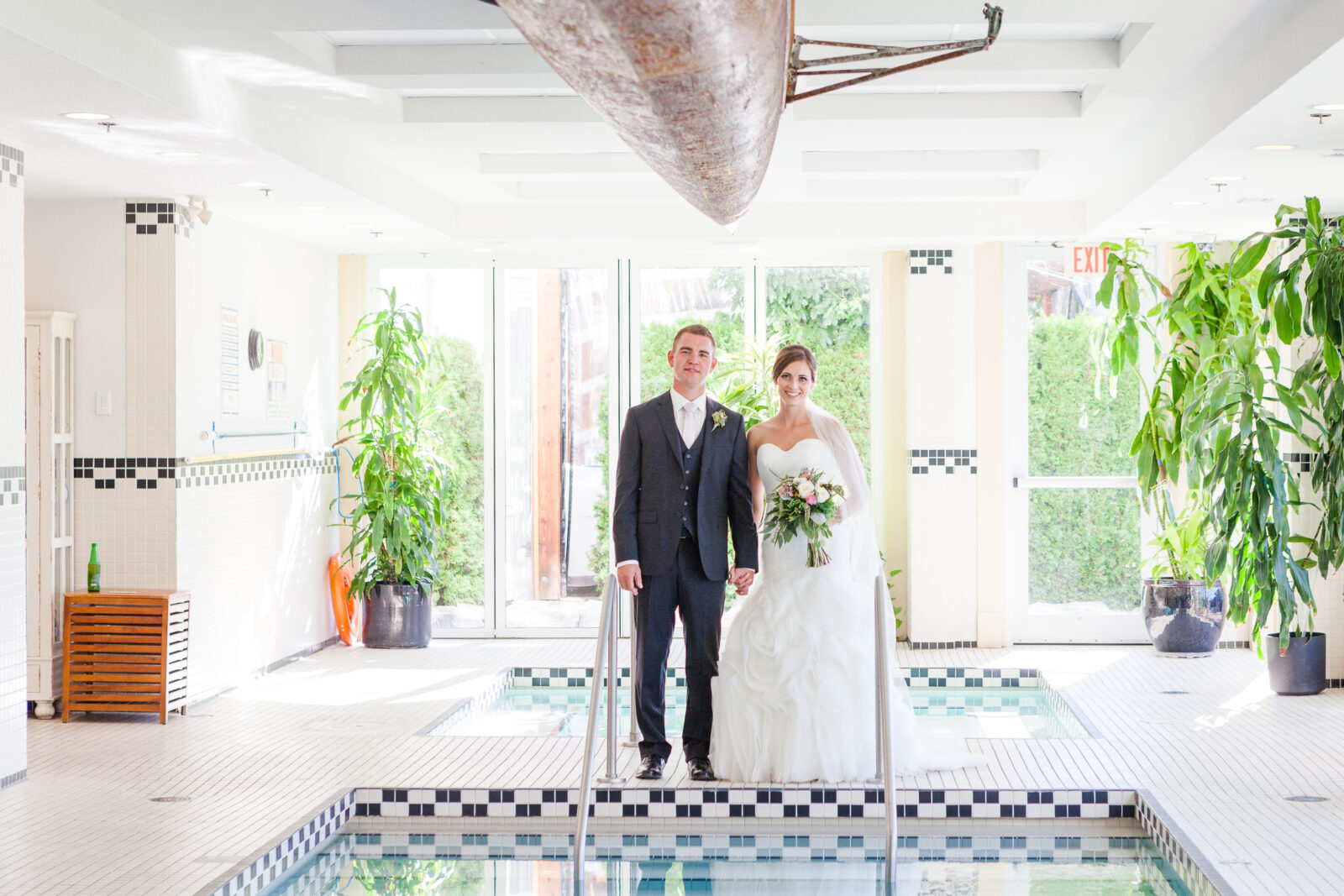 wedding couple at hotel eldorado resort indoor pool. 