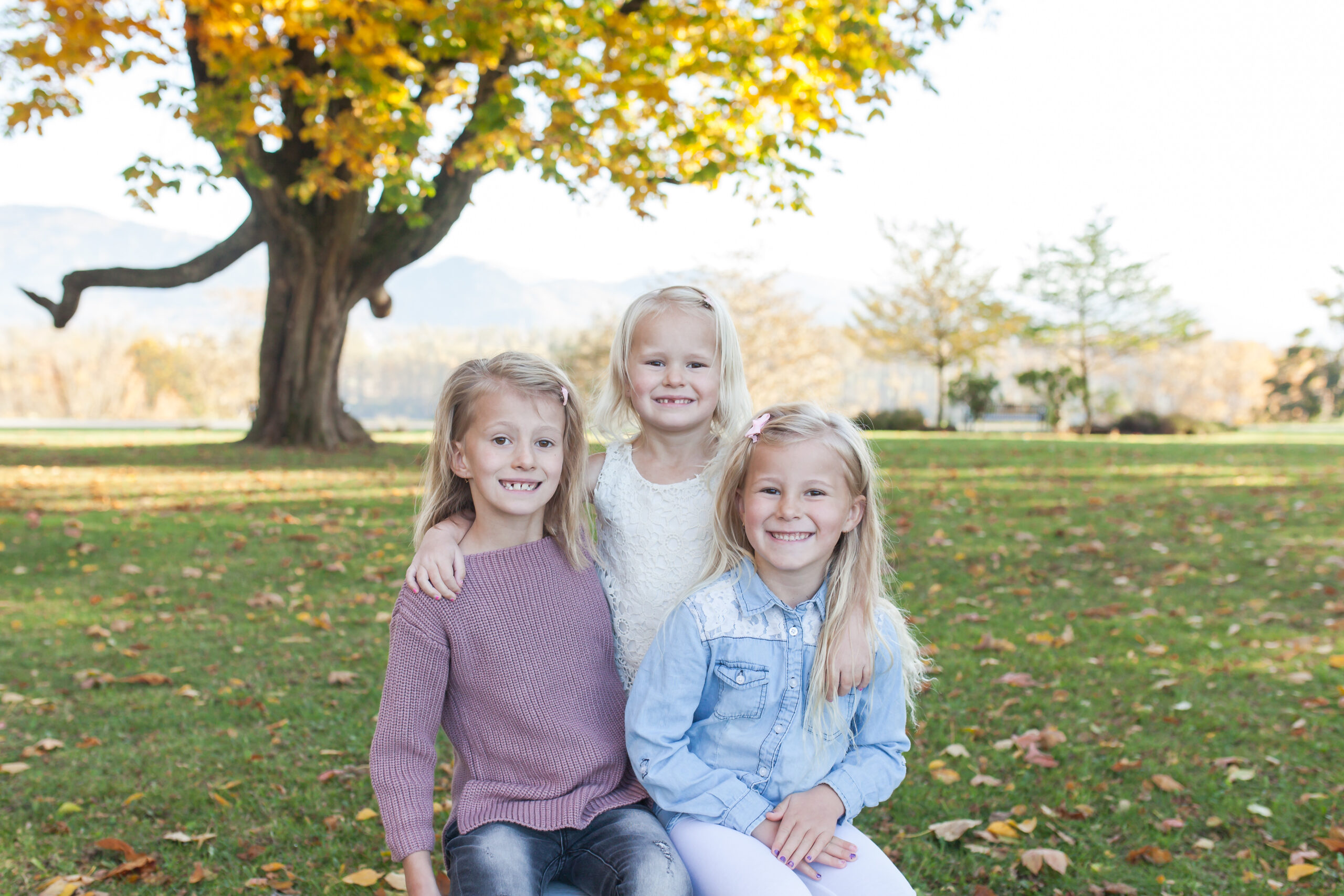 3 adorable sisters with beautiful smiles