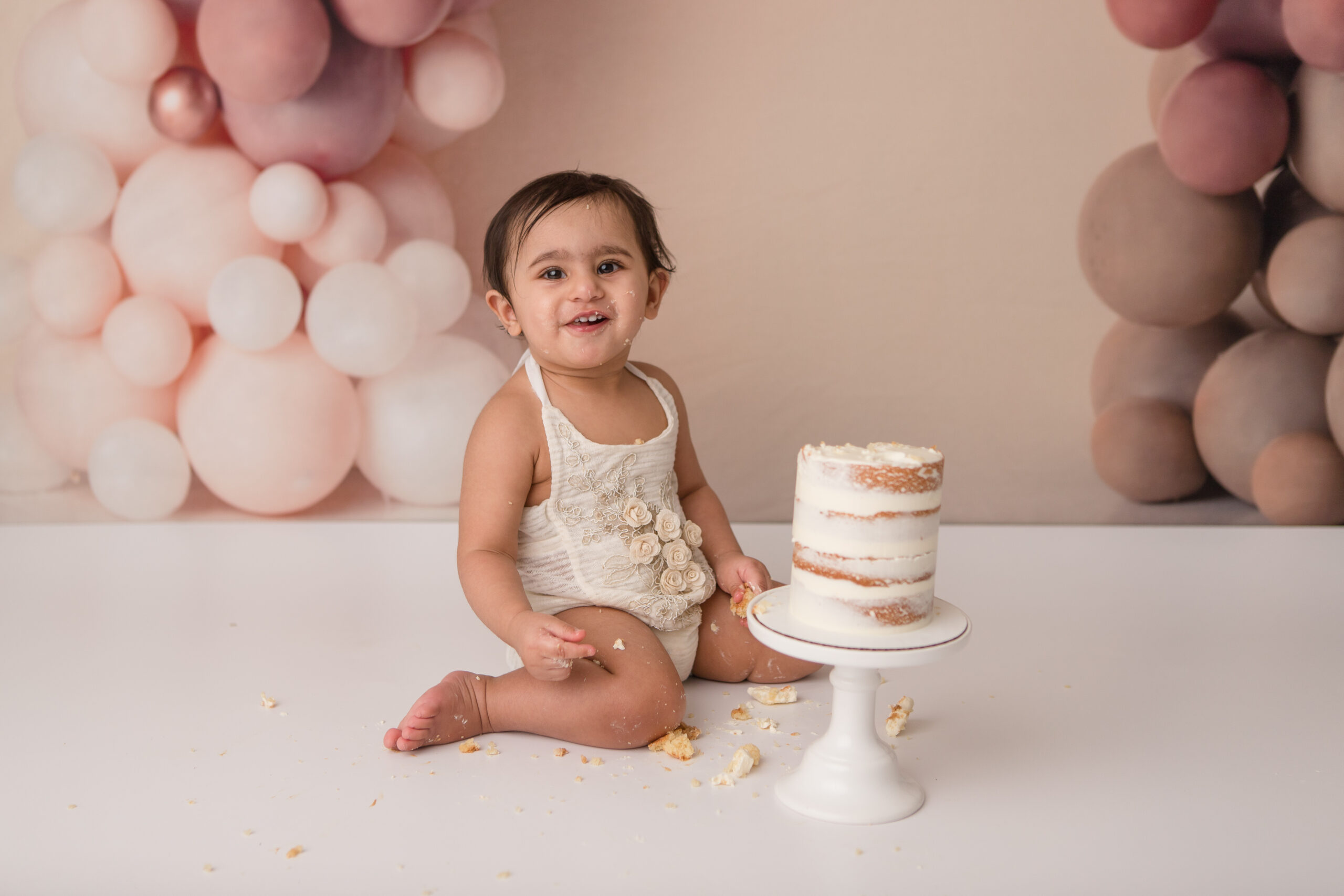 cute baby smashing a cake in kelowna studio